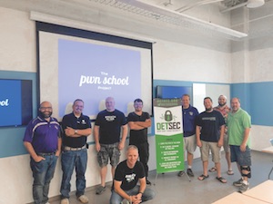 Tim Leonard, far left in the photo, was instrumental in partnering with The Pwn School Project, which educates IT professionals in ethical hacking.