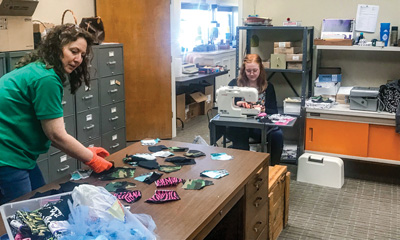 With closed lobbies and slowed business, employees at Alvord and Cooper Branches of Legend Bank make masks for healthcare workers and customers.