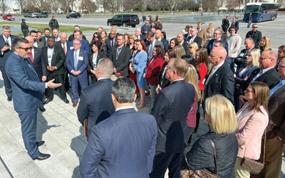 Texas Sen. Ted Cruz holds court on the Capitol steps with the Texas banker delegation.