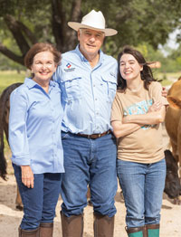 Sasser with his wife, Abbie, and their youngest daughter, Emily, at the family ranch.