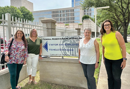 Austin Bank’s Tammy Dosser, Maebeth Cotton, Debbie Braune and Jennifer Mitchell outside of the Federal Reserve Bank of Dallas, host to the Texas Financial Literacy Summit.